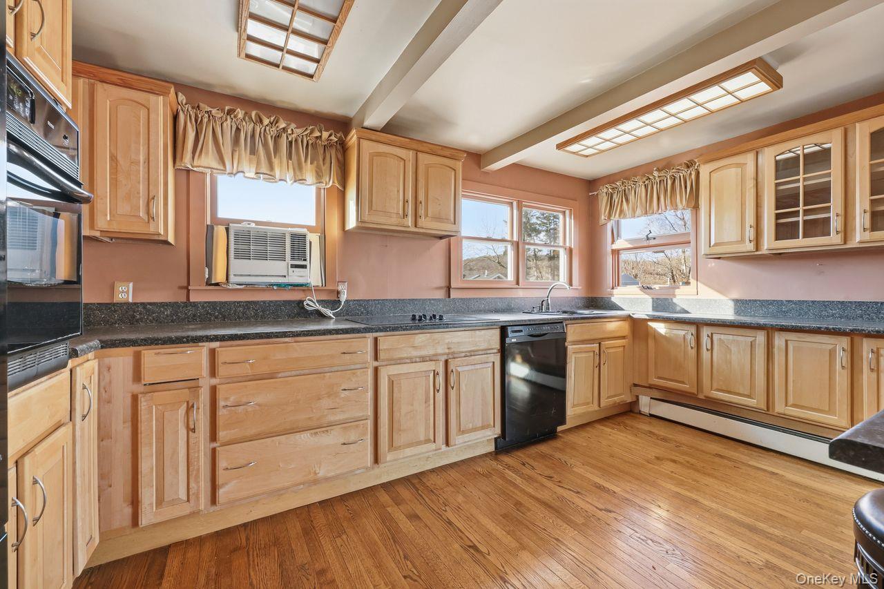 12 Sebago Road Carmel, NY 10512 - Photo 8 of 39 a kitchen with granite countertop white cabinets and white appliances