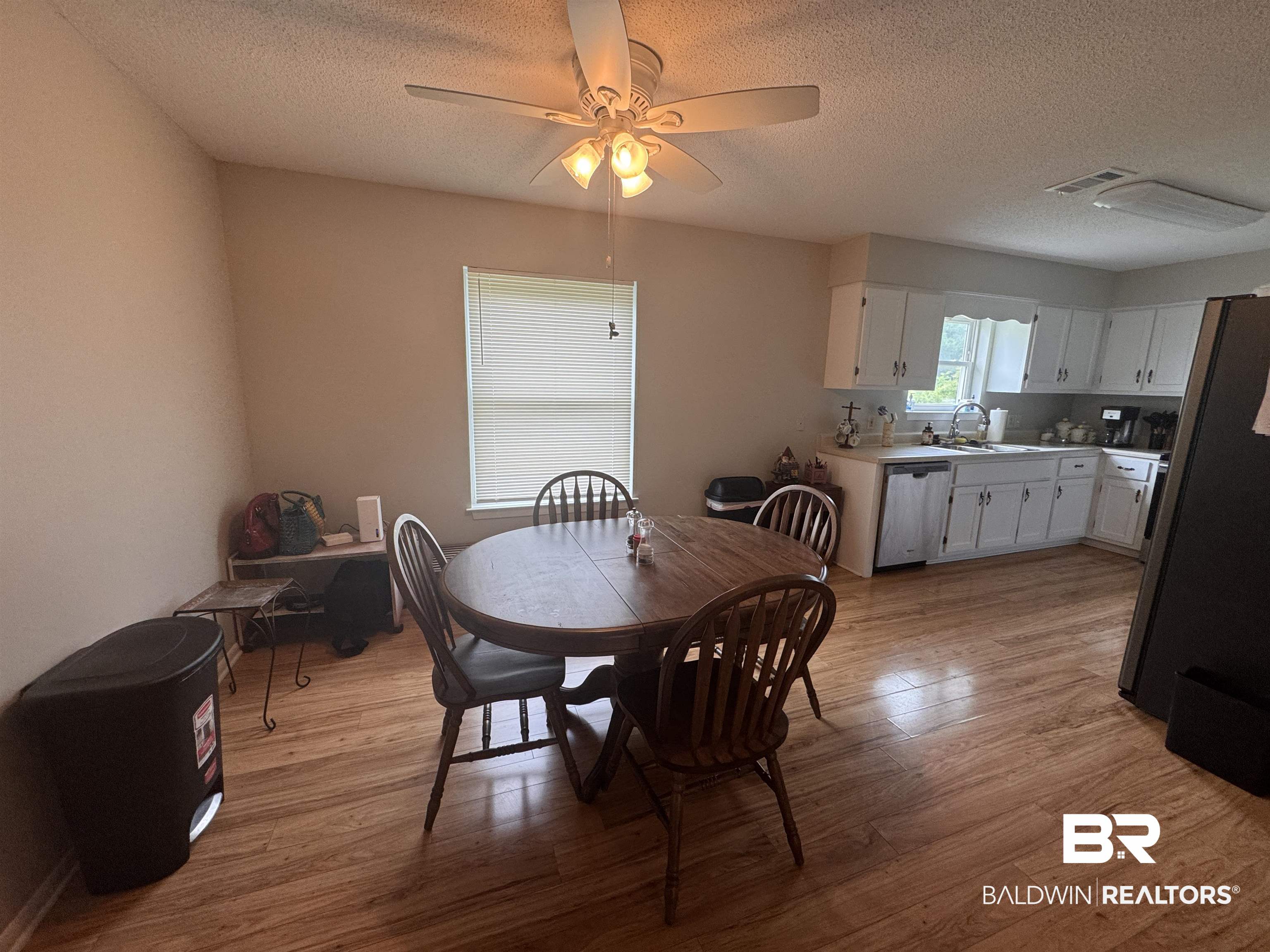 15148 Highland Circle Foley, AL 36535 - Photo 14 of 47 Dining space with wood finished floors, a textured ceiling, and ceiling fan
