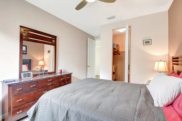 a bedroom with a bed and a dresser