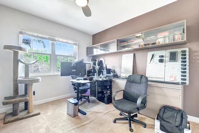 a work room with furniture and a window