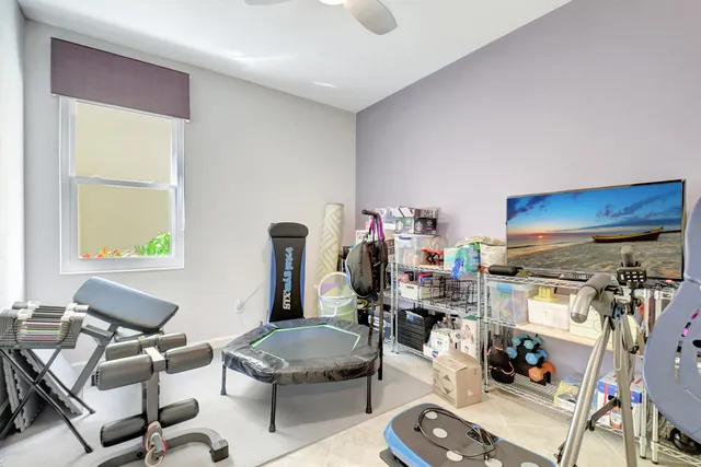 a room with furniture a rug and a window