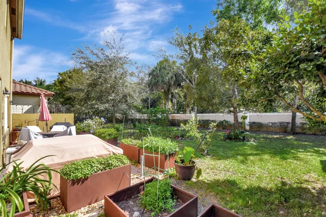 a view of a backyard with sitting area