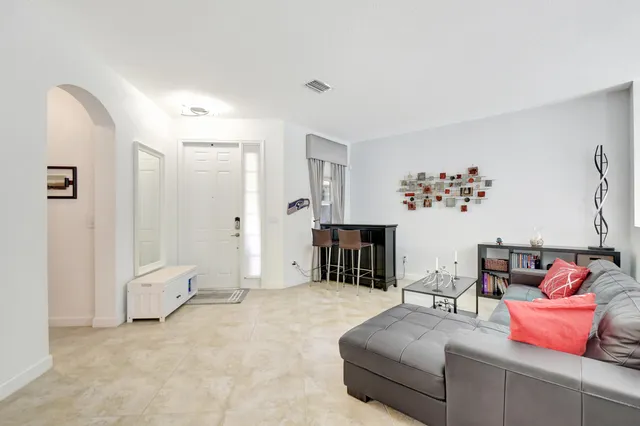 a spacious bedroom with a bed and a couch