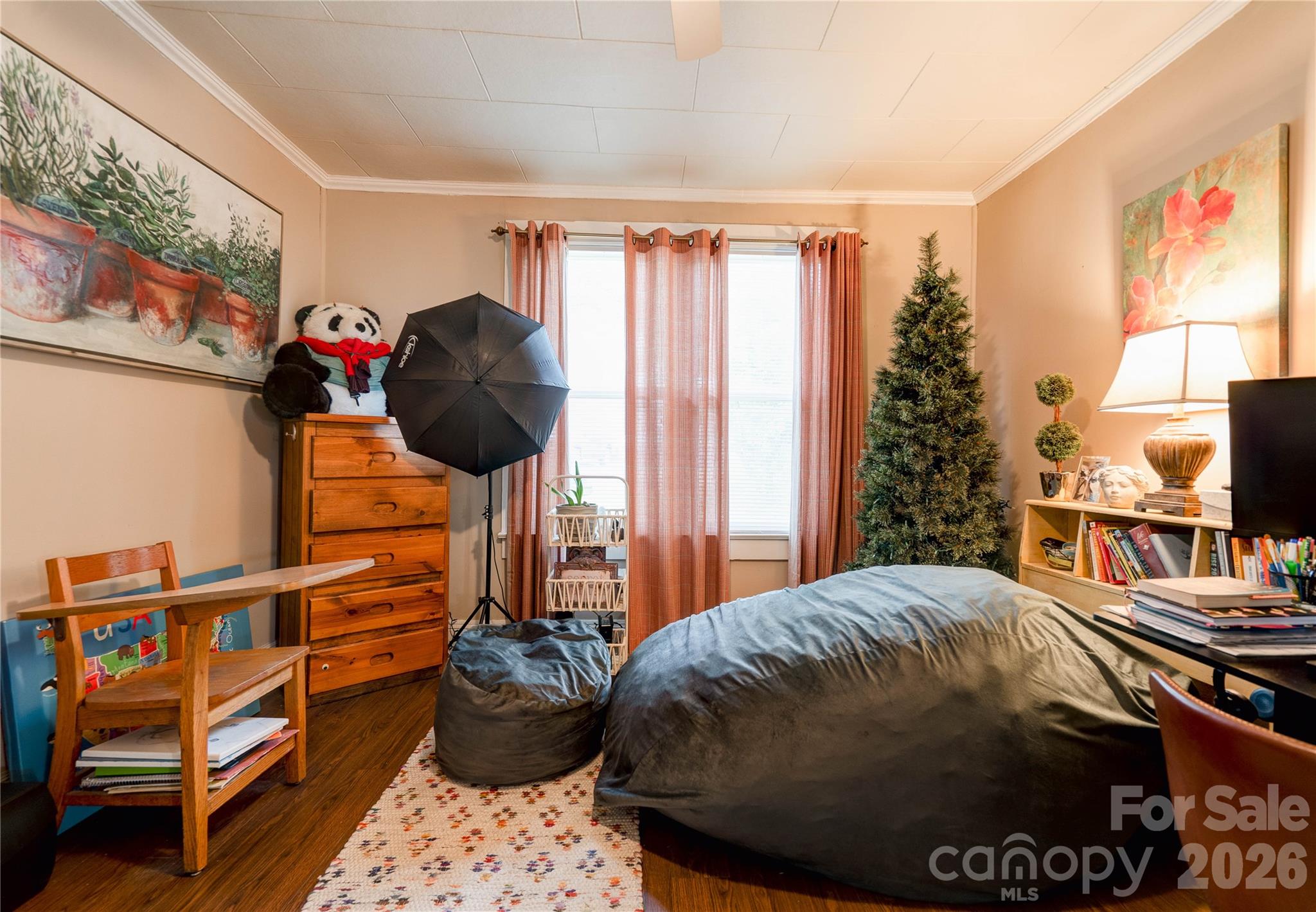 223 Waco Road Kings Mountain, NC 28086 - Photo 16 of 22 a bedroom with a bed and a chandelier