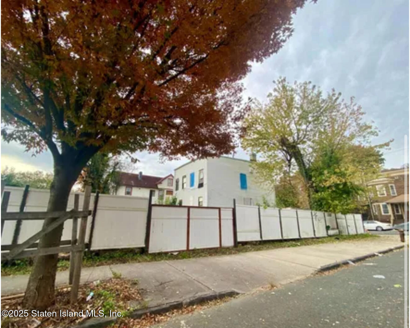 51 Gordon Street Staten Island, NY 10304 - Photo 4 of 5 a white house that has tree in front of it