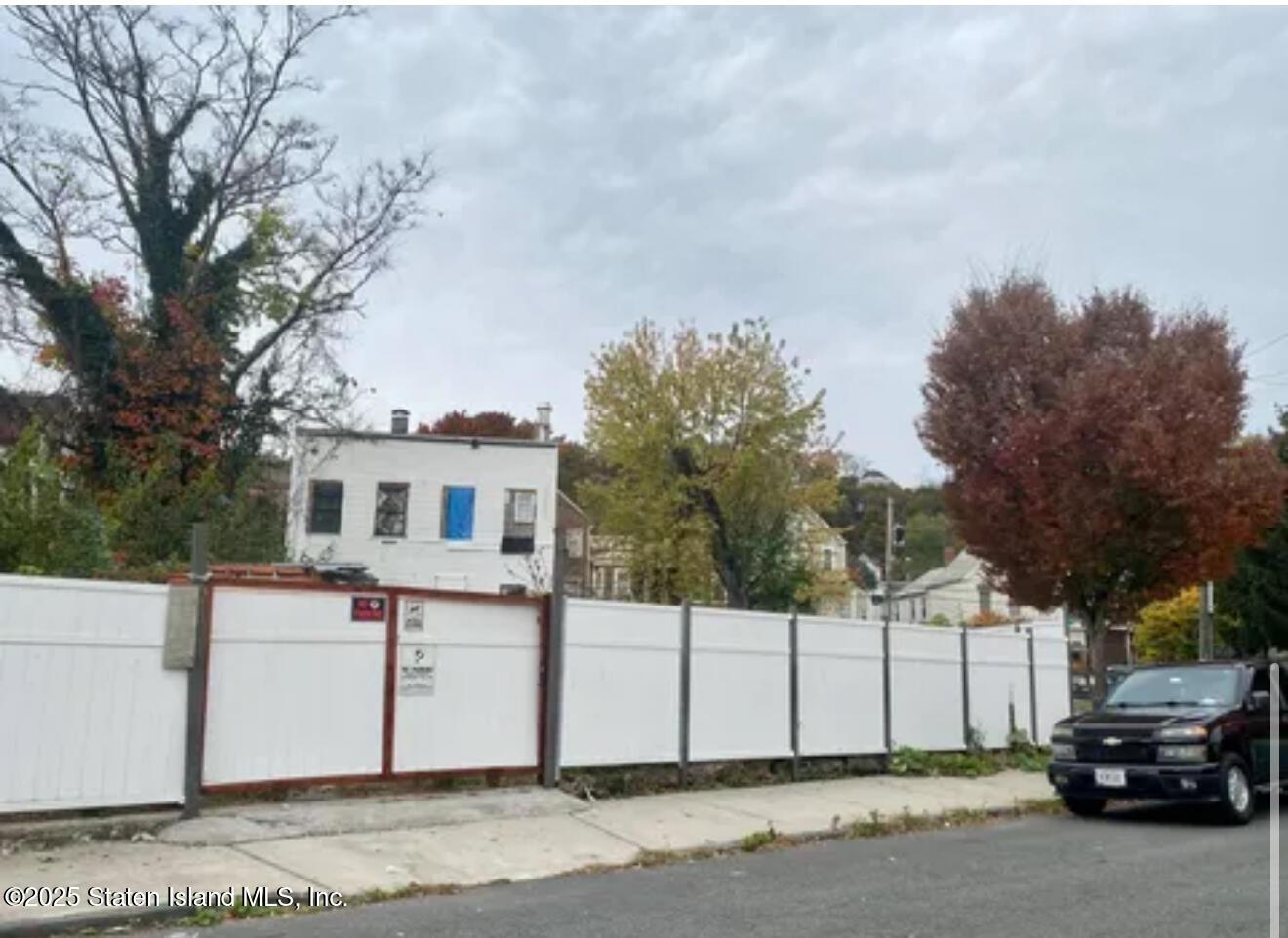 51 Gordon Street Staten Island, NY 10304 - Photo 5 of 5 a white house that has a tree in front of it