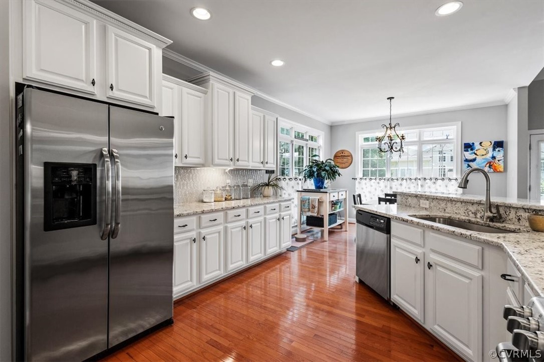 14701 Yarcombe Road Midlothian, VA 23112 - Photo 11 of 44 a kitchen with stainless steel appliances granite countertop a refrigerator sink and cabinets