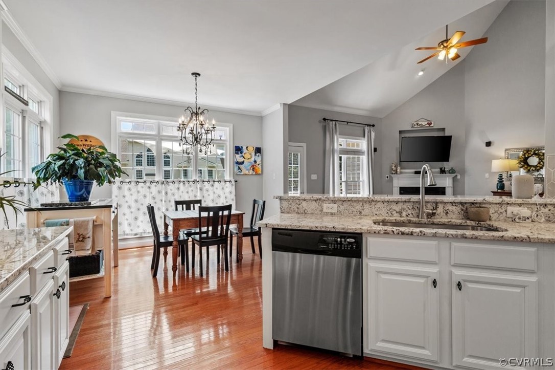 14701 Yarcombe Road Midlothian, VA 23112 - Photo 14 of 44 a kitchen with sink and center island with wooden floor