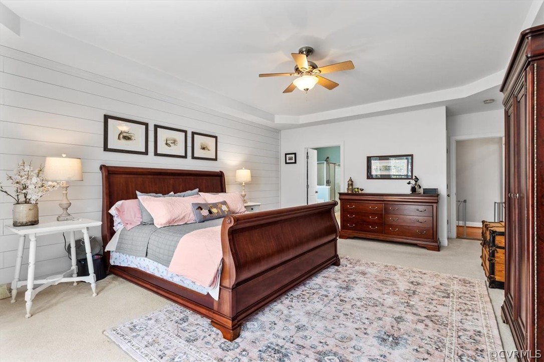 14701 Yarcombe Road Midlothian, VA 23112 - Photo 22 of 44 a bedroom with a bed and a chandelier