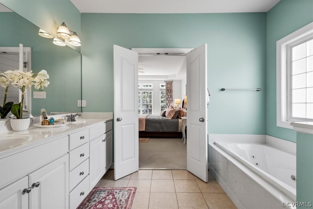 14701 Yarcombe Road Midlothian, VA 23112 - Photo 24 of 44 a en suite spacious bathroom with a tub double vanity and window