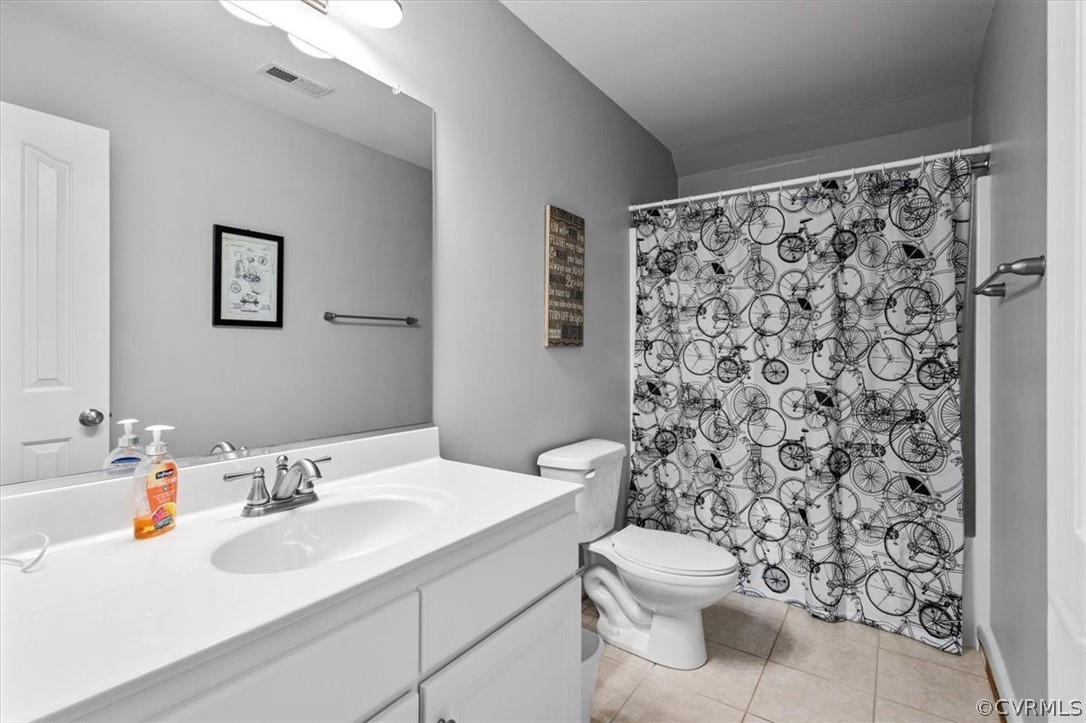 14701 Yarcombe Road Midlothian, VA 23112 - Photo 26 of 44 a bathroom with a sink toilet and shower