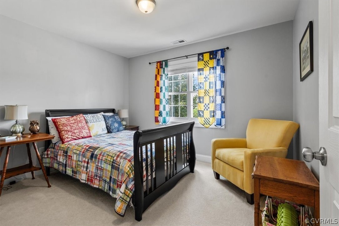 14701 Yarcombe Road Midlothian, VA 23112 - Photo 27 of 44 a bedroom with a bed and wooden floor