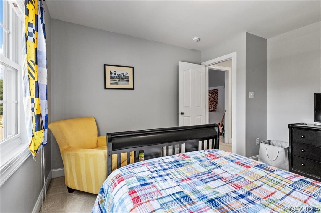 14701 Yarcombe Road Midlothian, VA 23112 - Photo 28 of 44 a bedroom with a bed and wooden floor