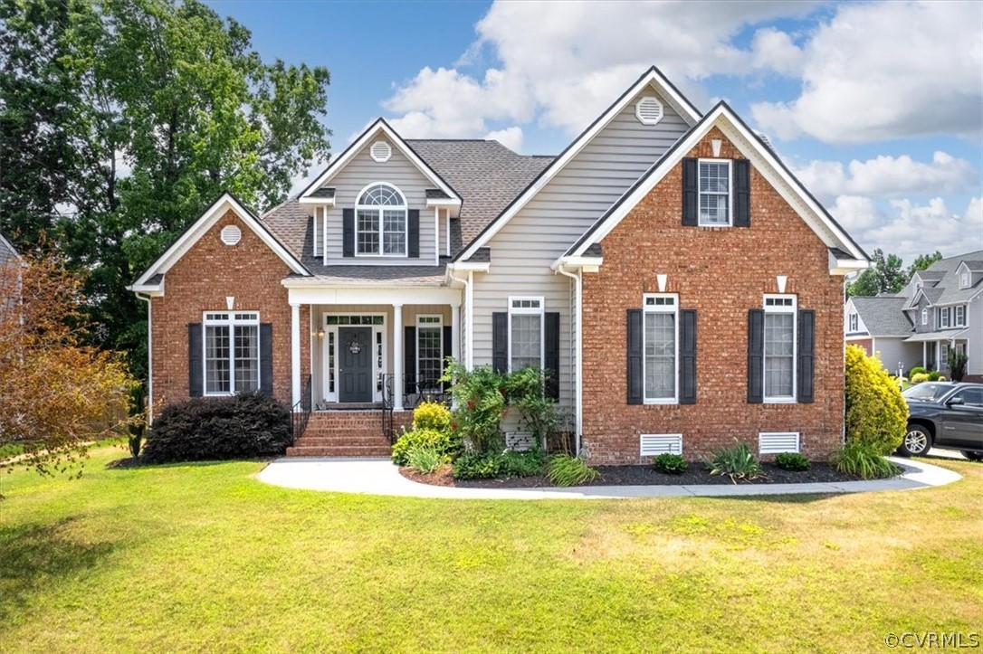 14701 Yarcombe Road Midlothian, VA 23112 - Photo 3 of 44 a front view of a house with a yard
