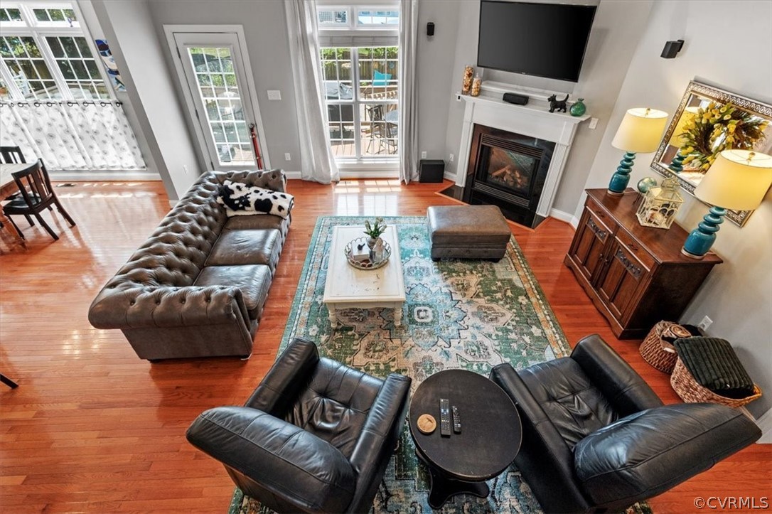 14701 Yarcombe Road Midlothian, VA 23112 - Photo 32 of 44 a living room with furniture fireplace and flat screen tv
