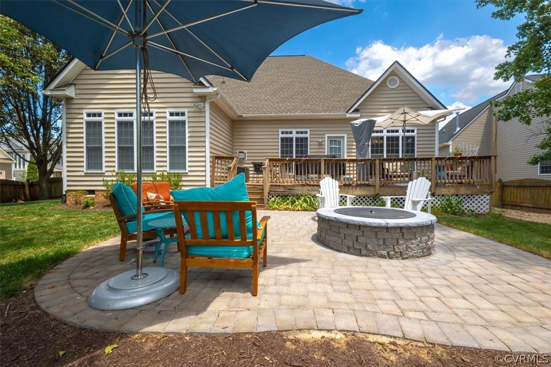 14701 Yarcombe Road Midlothian, VA 23112 - Photo 35 of 44 a front view of a house with a yard table and chairs