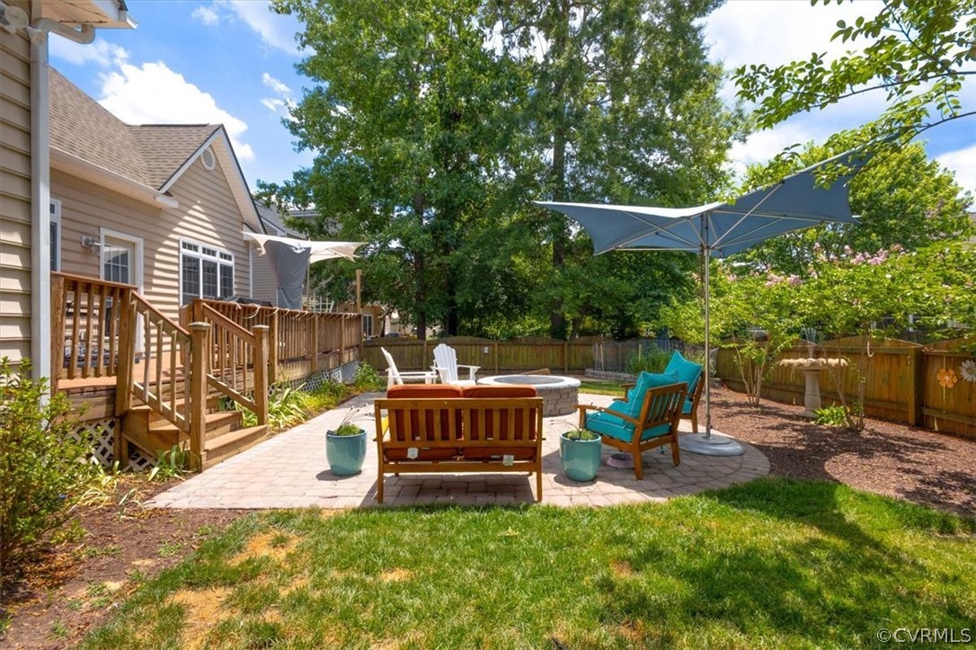 14701 Yarcombe Road Midlothian, VA 23112 - Photo 37 of 44 a view of backyard with a table and chairs