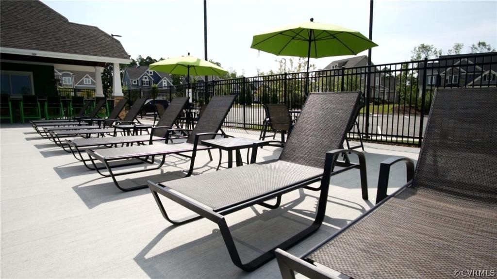 14701 Yarcombe Road Midlothian, VA 23112 - Photo 42 of 44 a view of a patio with a table chairs and barbeque