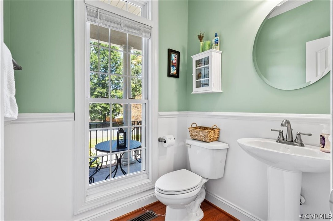 14701 Yarcombe Road Midlothian, VA 23112 - Photo 7 of 44 a bathroom with a toilet a sink and a mirror