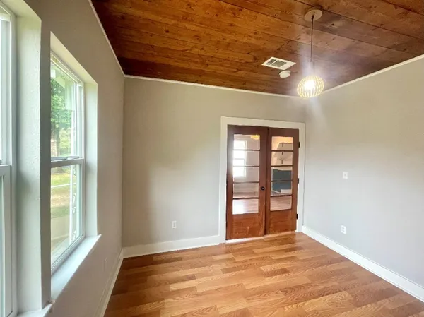 a view of an empty room with a window