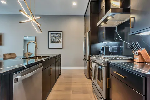 a kitchen with a stove and a sink