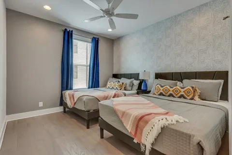 a bedroom with bed and window