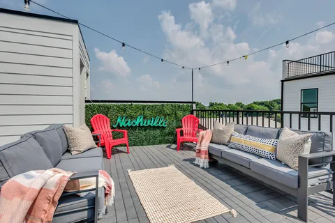 a outdoor living space with patio furniture and a potted plant