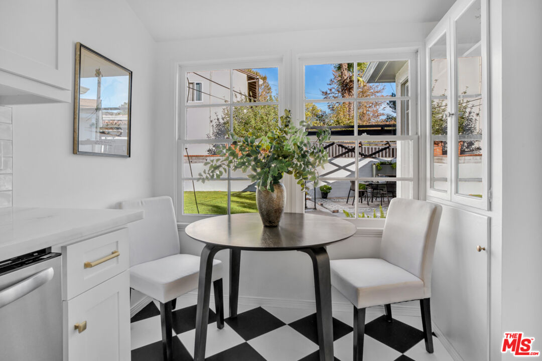 1901 Montecito Drive Glendale, CA 91208 - Photo 16 of 64 a dining room with furniture and wooden floor