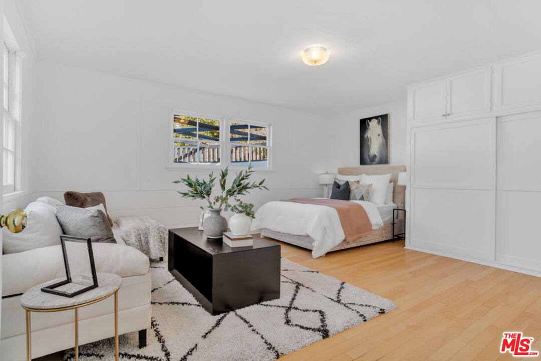 1901 Montecito Drive Glendale, CA 91208 - Photo 35 of 64 a bedroom with a bed and chair