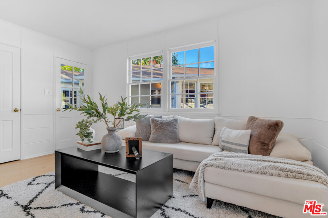 1901 Montecito Drive Glendale, CA 91208 - Photo 36 of 64 a living room with furniture and a potted plant