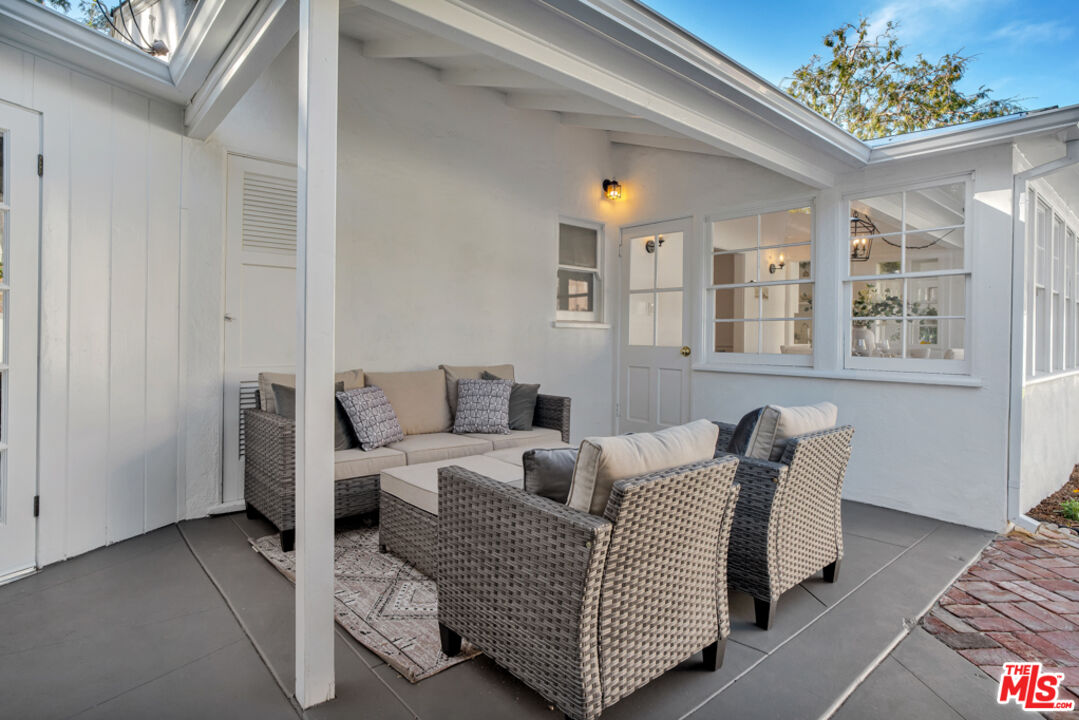 1901 Montecito Drive Glendale, CA 91208 - Photo 46 of 64 a living room with furniture and a chandelier
