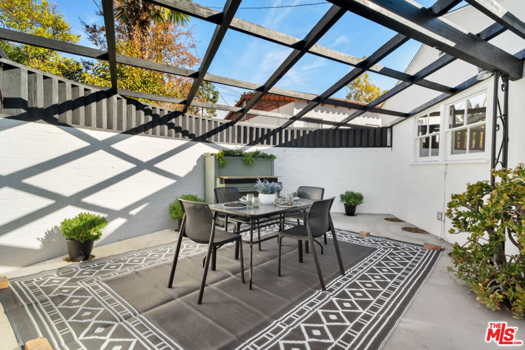1901 Montecito Drive Glendale, CA 91208 - Photo 48 of 64 a roof deck with table and chairs and potted plants