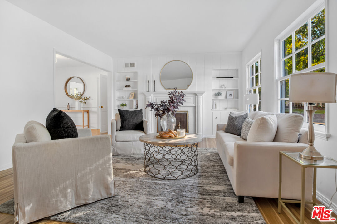1901 Montecito Drive Glendale, CA 91208 - Photo 5 of 64 a living room with furniture a clock and a large window