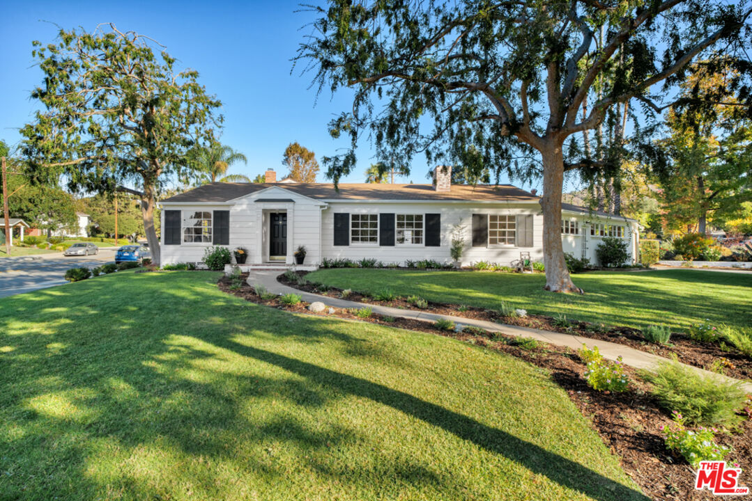 1901 Montecito Drive Glendale, CA 91208 - Photo 52 of 64 a front view of a house with a yard table and chairs