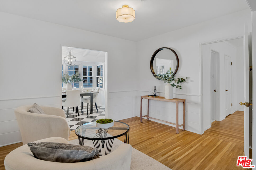 1901 Montecito Drive Glendale, CA 91208 - Photo 8 of 64 a living room with furniture a rug and a wooden floor