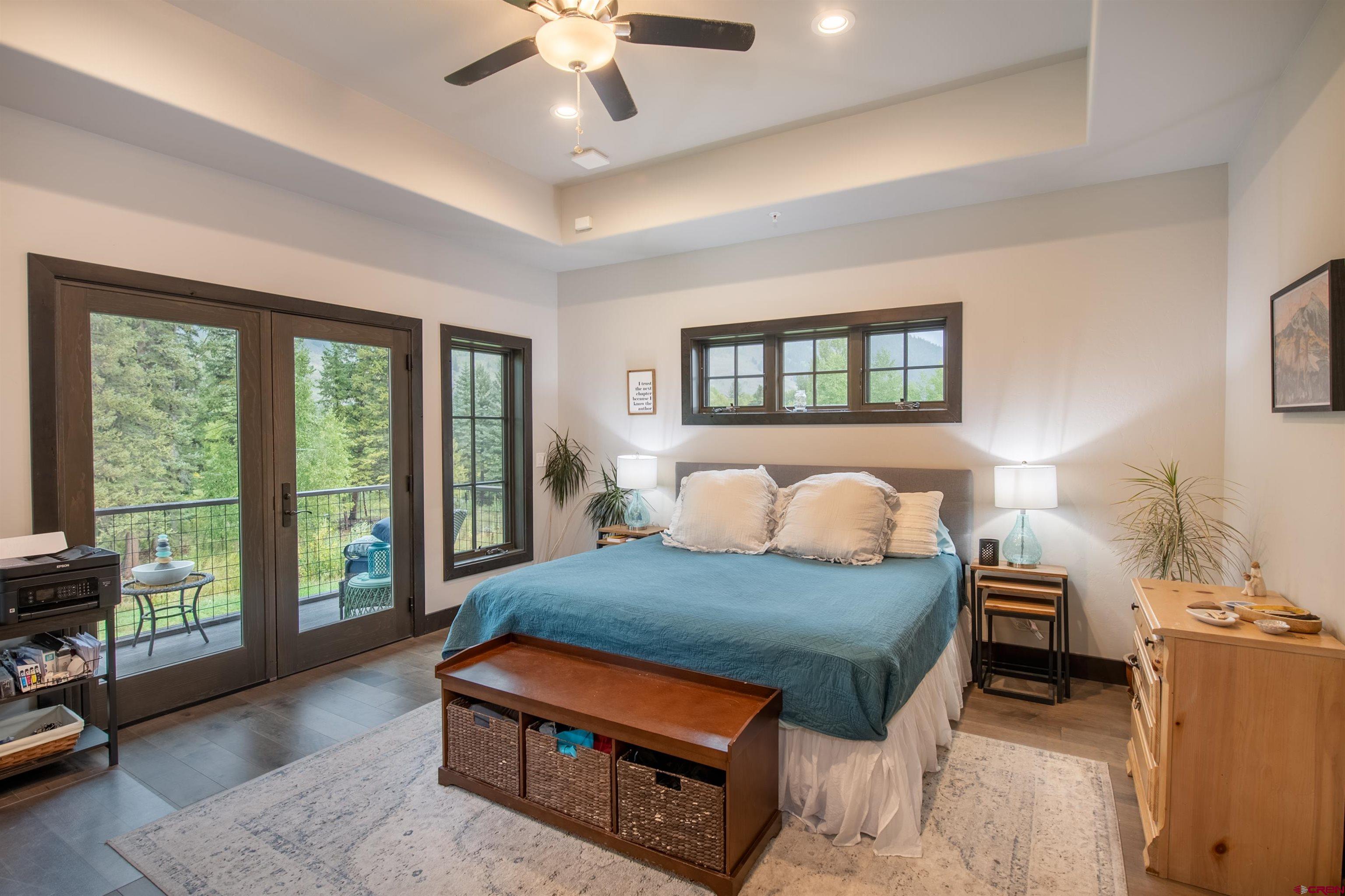 23 Jacquelyn Lane Crested Butte, CO 81224 - Photo 16 of 33 a bedroom with a large bed and a large window