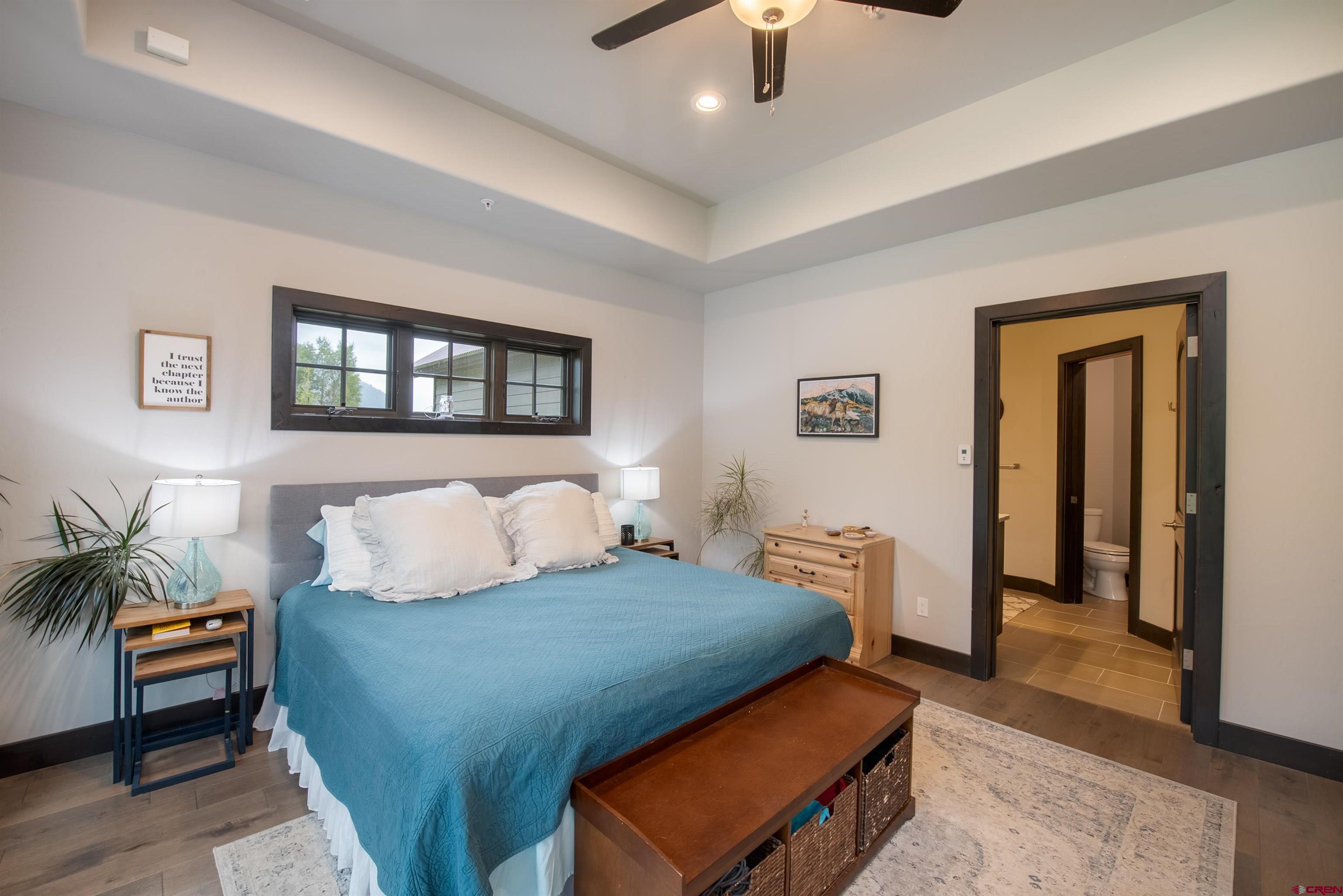 23 Jacquelyn Lane Crested Butte, CO 81224 - Photo 17 of 33 a bedroom with furniture and a potted plant