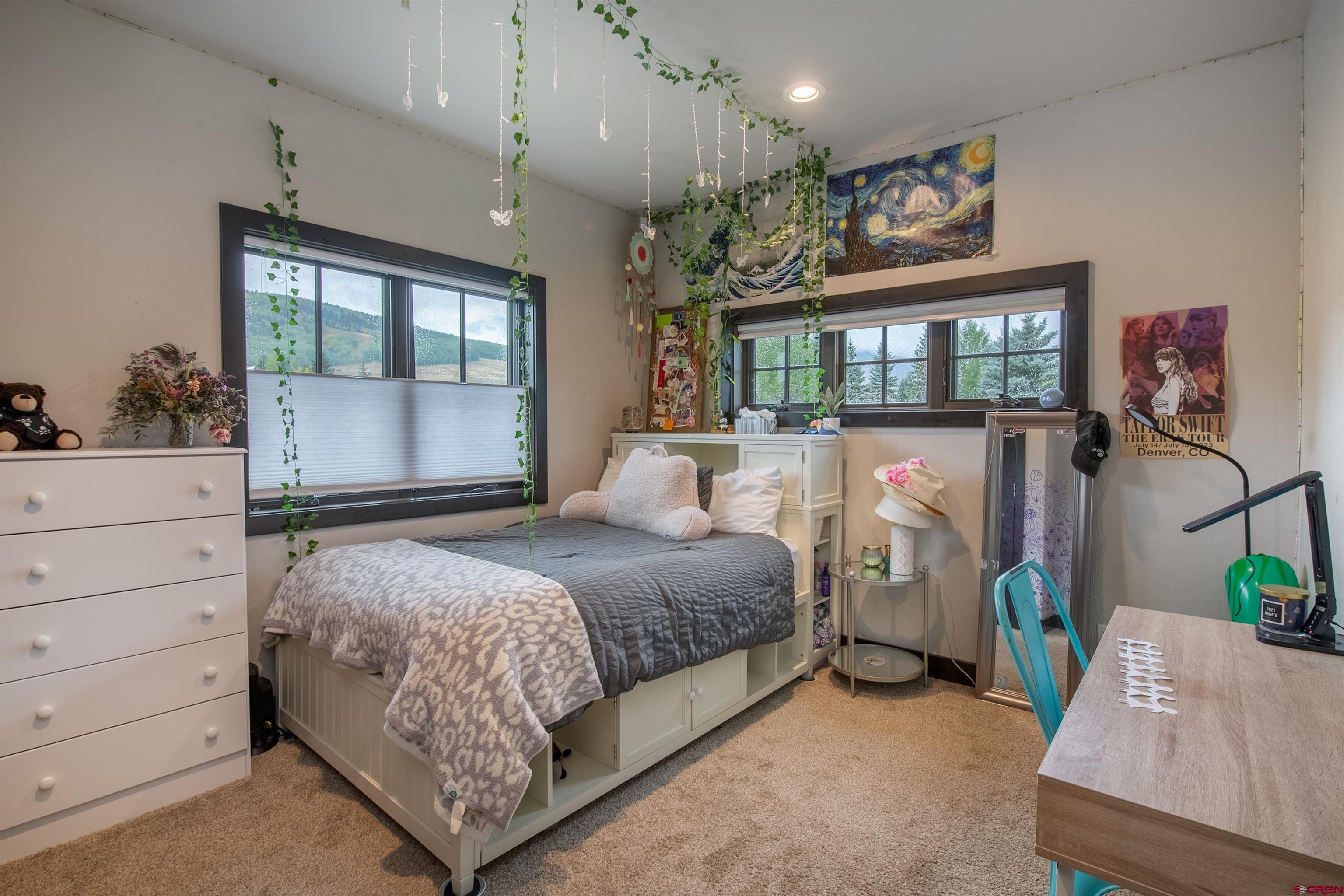 23 Jacquelyn Lane Crested Butte, CO 81224 - Photo 19 of 33 a bedroom with bed and wooden floor