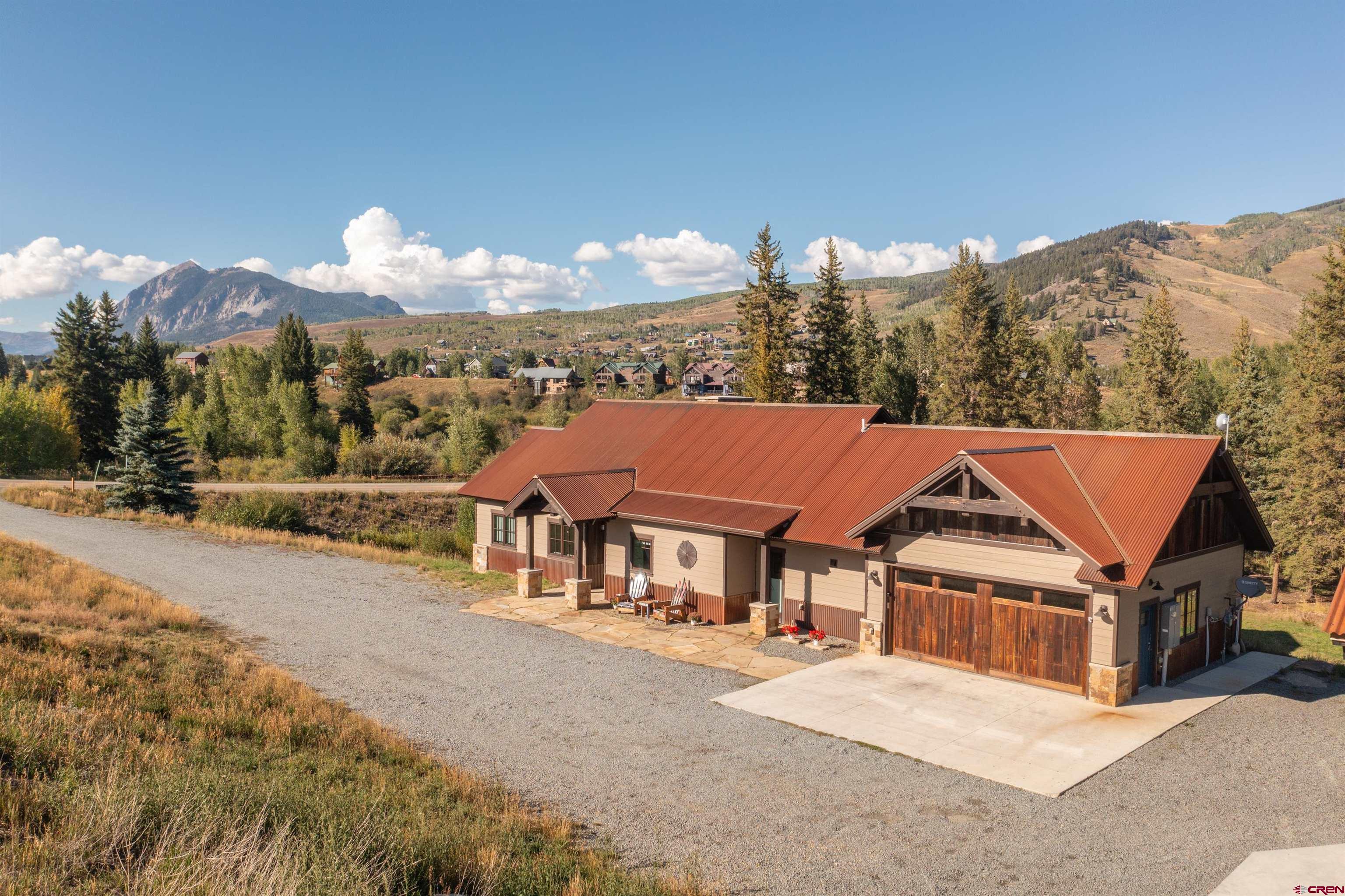 23 Jacquelyn Lane Crested Butte, CO 81224 - Photo 2 of 33 front view of a house with a street