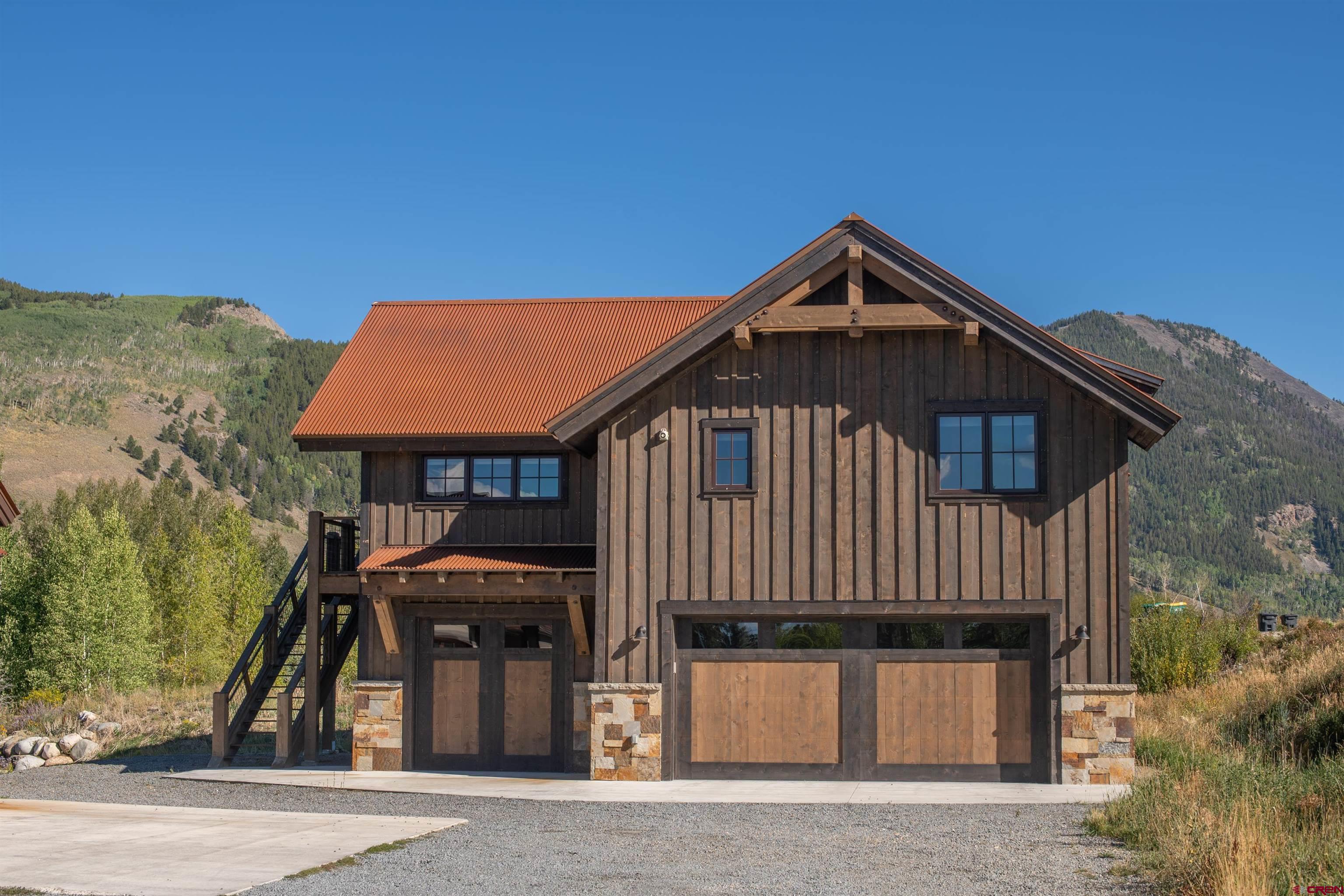 23 Jacquelyn Lane Crested Butte, CO 81224 - Photo 26 of 33 a front view of a house with a yard