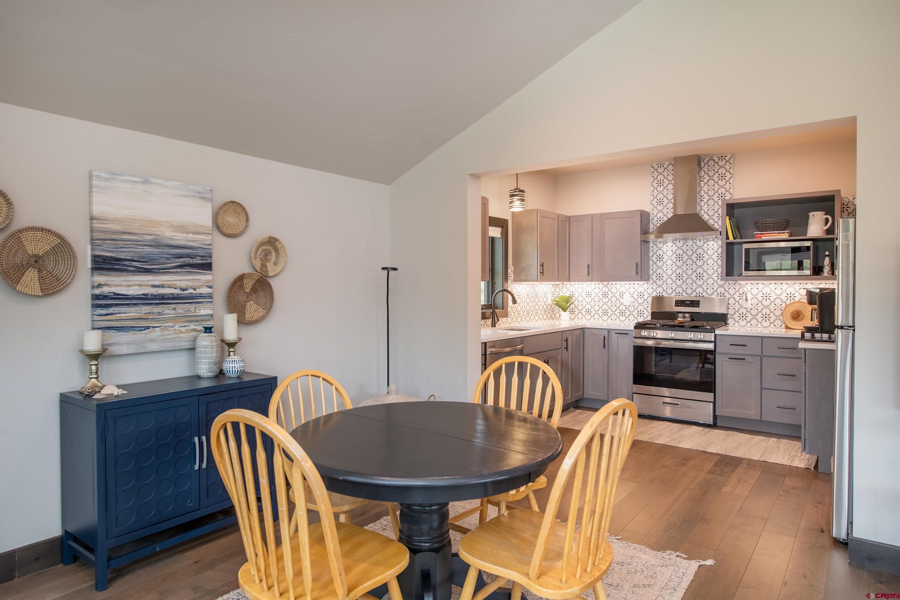 23 Jacquelyn Lane Crested Butte, CO 81224 - Photo 27 of 33 a kitchen with stainless steel appliances kitchen island granite countertop a kitchen island hardwood floor and a sink
