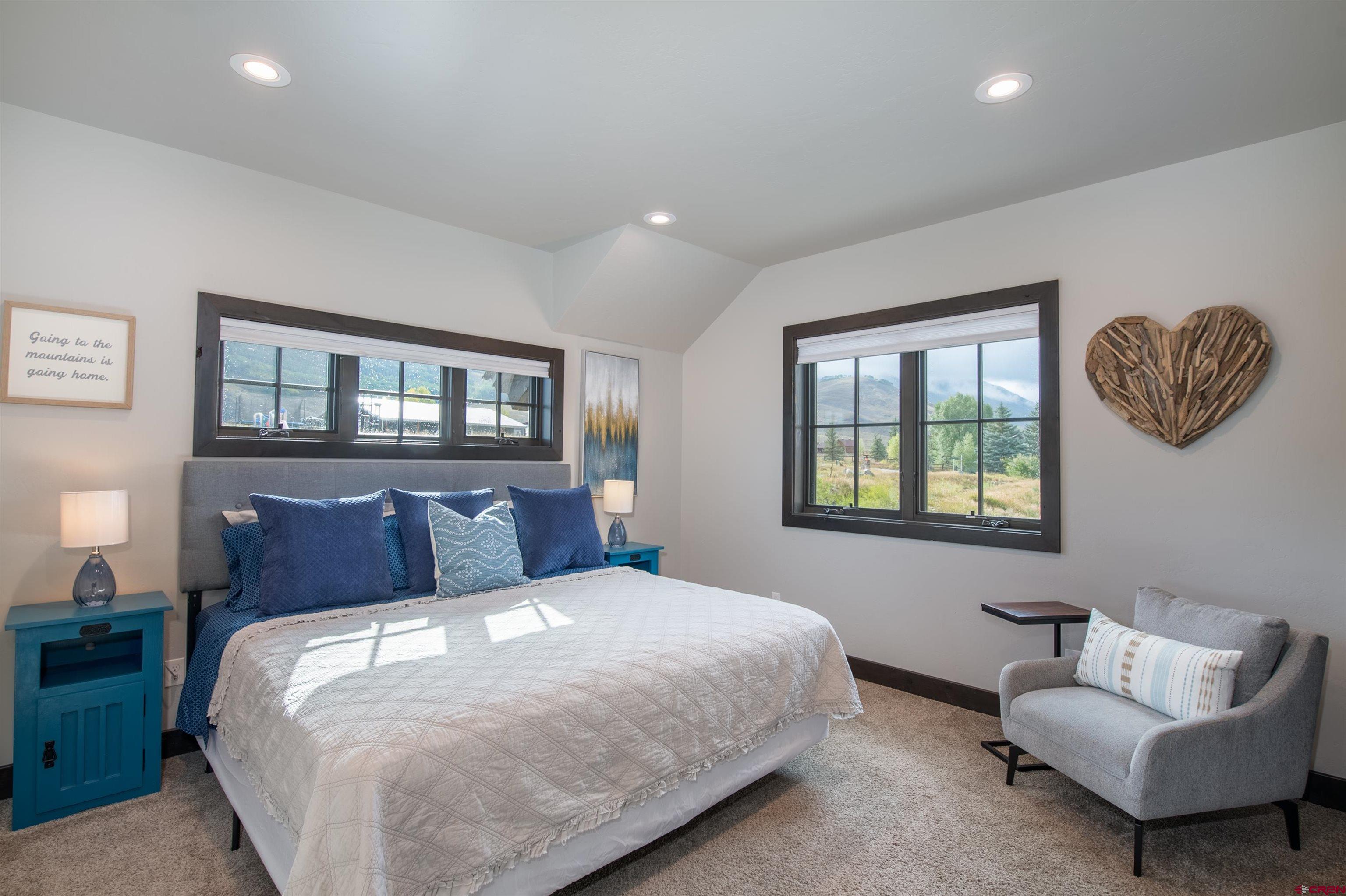 23 Jacquelyn Lane Crested Butte, CO 81224 - Photo 31 of 33 a bedroom with a bed and a couch