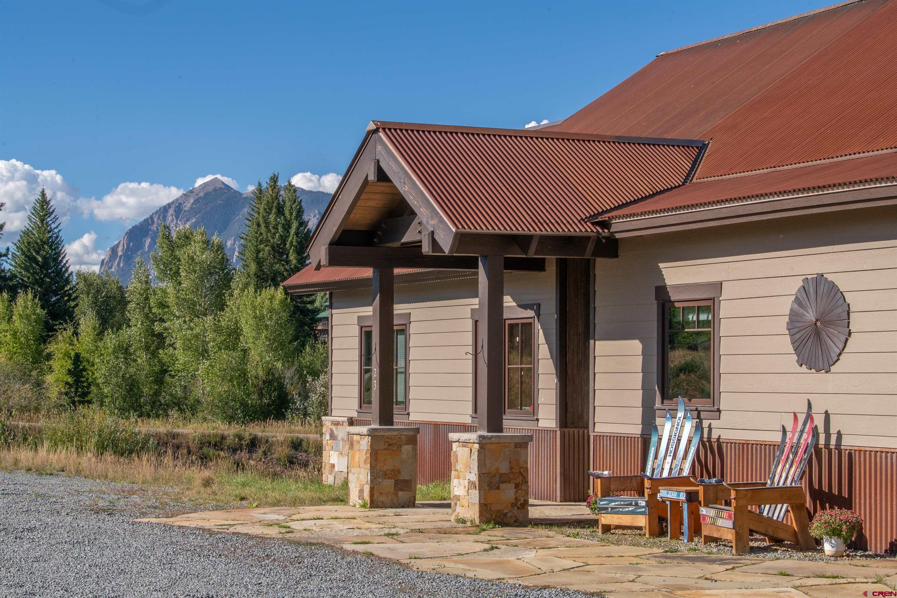 23 Jacquelyn Lane Crested Butte, CO 81224 - Photo 4 of 33 a front view of a house with a yard