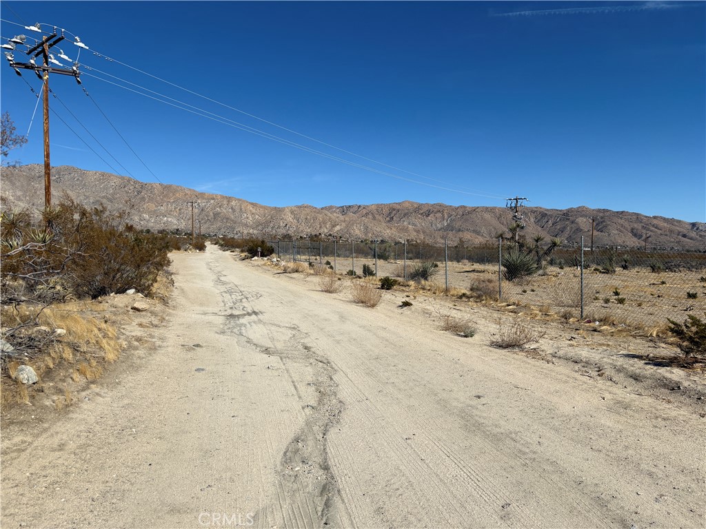 9825 Fobes Road Morongo Valley, CA 92256 - Photo 14 of 28 a view of a dry field with a view of mountains