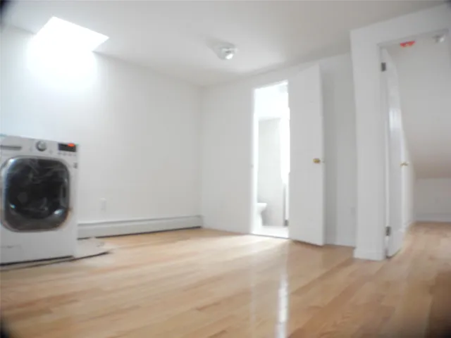 a view of a storage & utility room with wooden floor