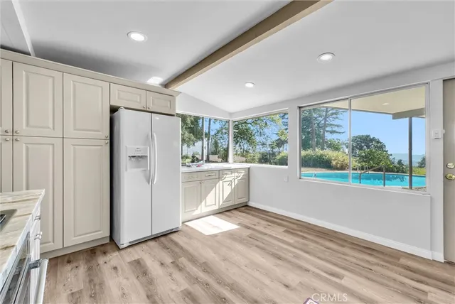 a view of a patio with a table and chairs