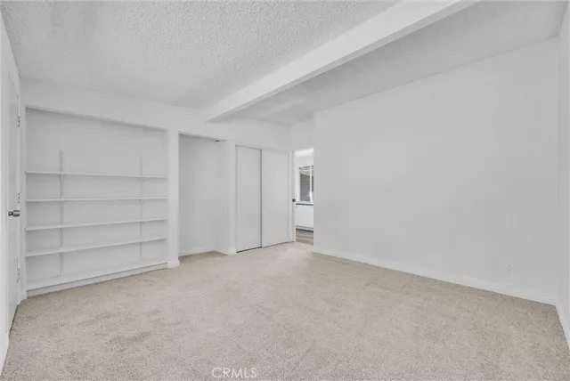 an aerial view of residential house and sandy dunes