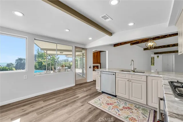 a bathroom with a double vanity sink mirror and shower