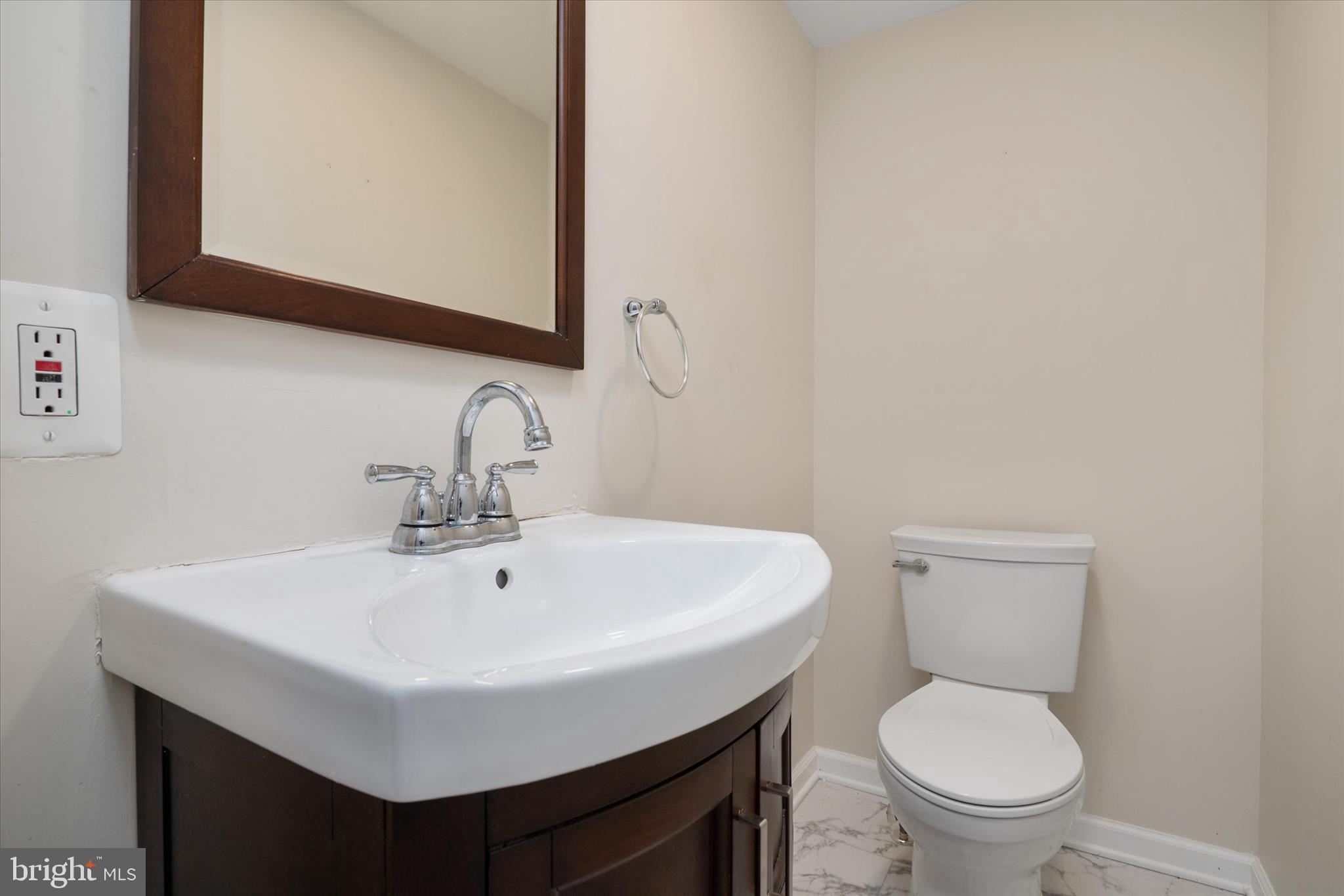 226 Compass Road Baltimore, MD 21221 - Photo 16 of 35 a bathroom with a sink a toilet and mirror
