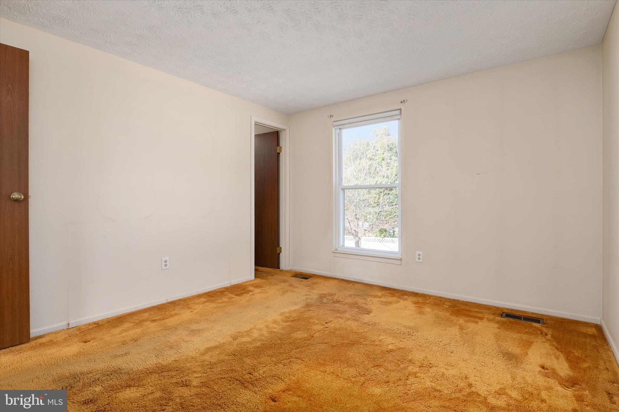 226 Compass Road Baltimore, MD 21221 - Photo 18 of 35 a view of an empty room with a window